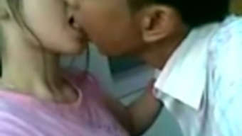 Lewd Asian Couple Kisses And Spoons In A Bit Shy Way On Camera