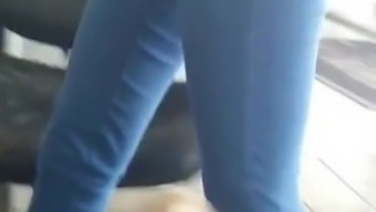 Cute Redhead In Flip Flops Crossing Her Legs