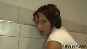 Two Guys Fucking And Pissing On A Babe In The Bathroom