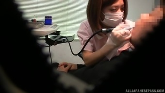 Asian Nurse Pleases A Patient By Jerking His Stiff Pecker