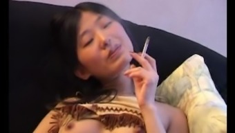 Asian Smoking Naked On Couch