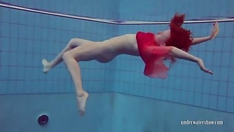 Sexy Redhead With Nice Milkers Swimming Underwater Naked