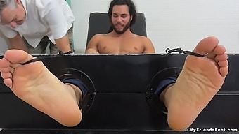 Handsome Man Enjoys While His Kinky Friend Tickles His Feet