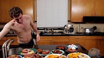 A Well-Groomed Man Indulges In Pleasure While Cooking In The Background
