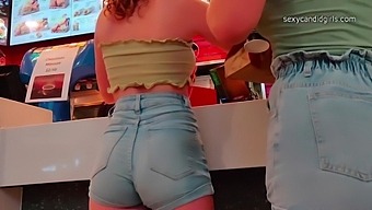 Voyeur Footage Of A Redhead In Public And In Her Tight Shorts