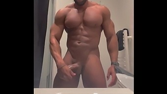 Gay Muscle Man Strokes His Cock